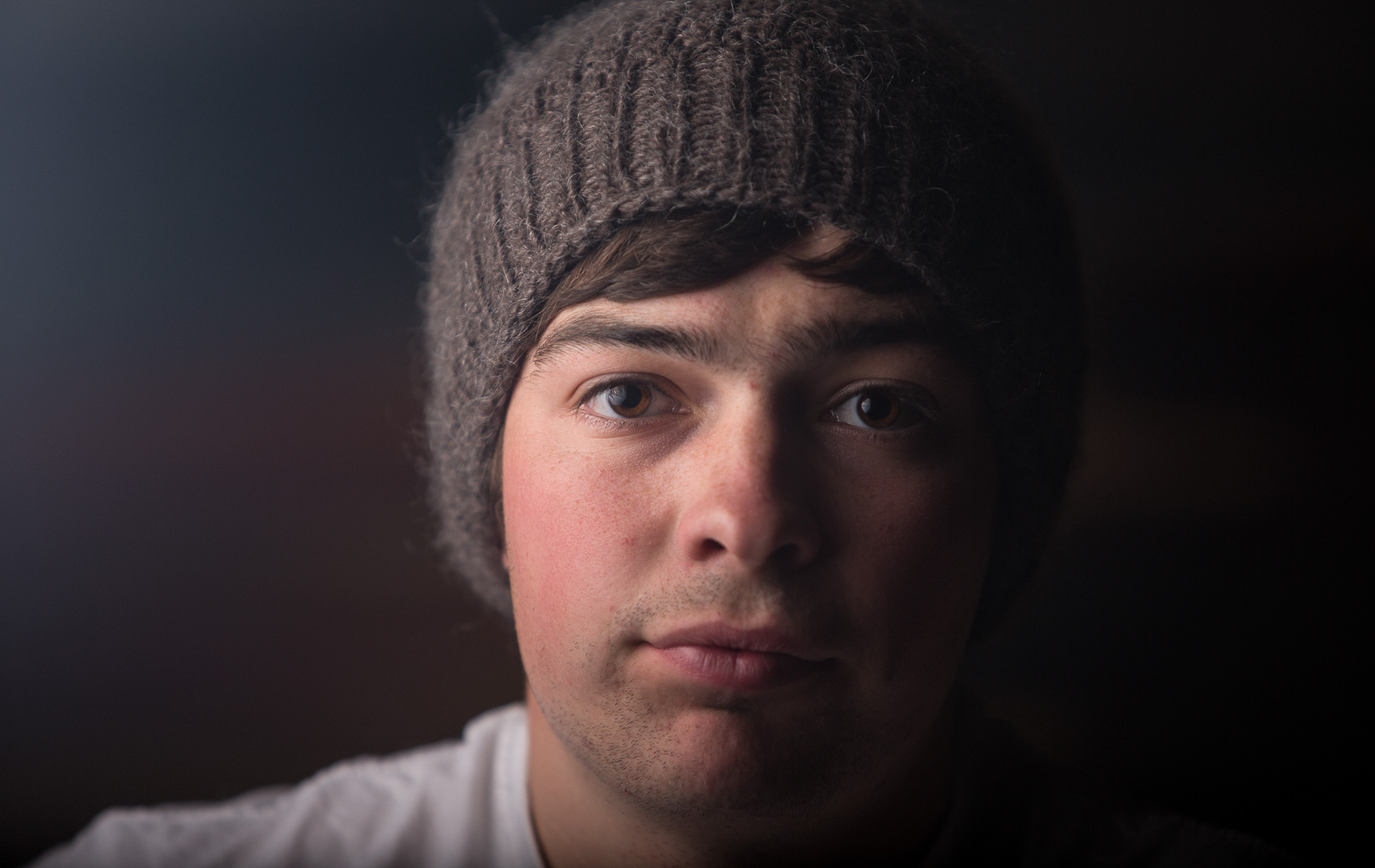 Close up portrait of young adult male by Paul Green Photographer